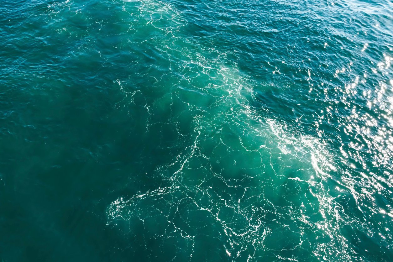 turquoise color sea and ship wave in the sea